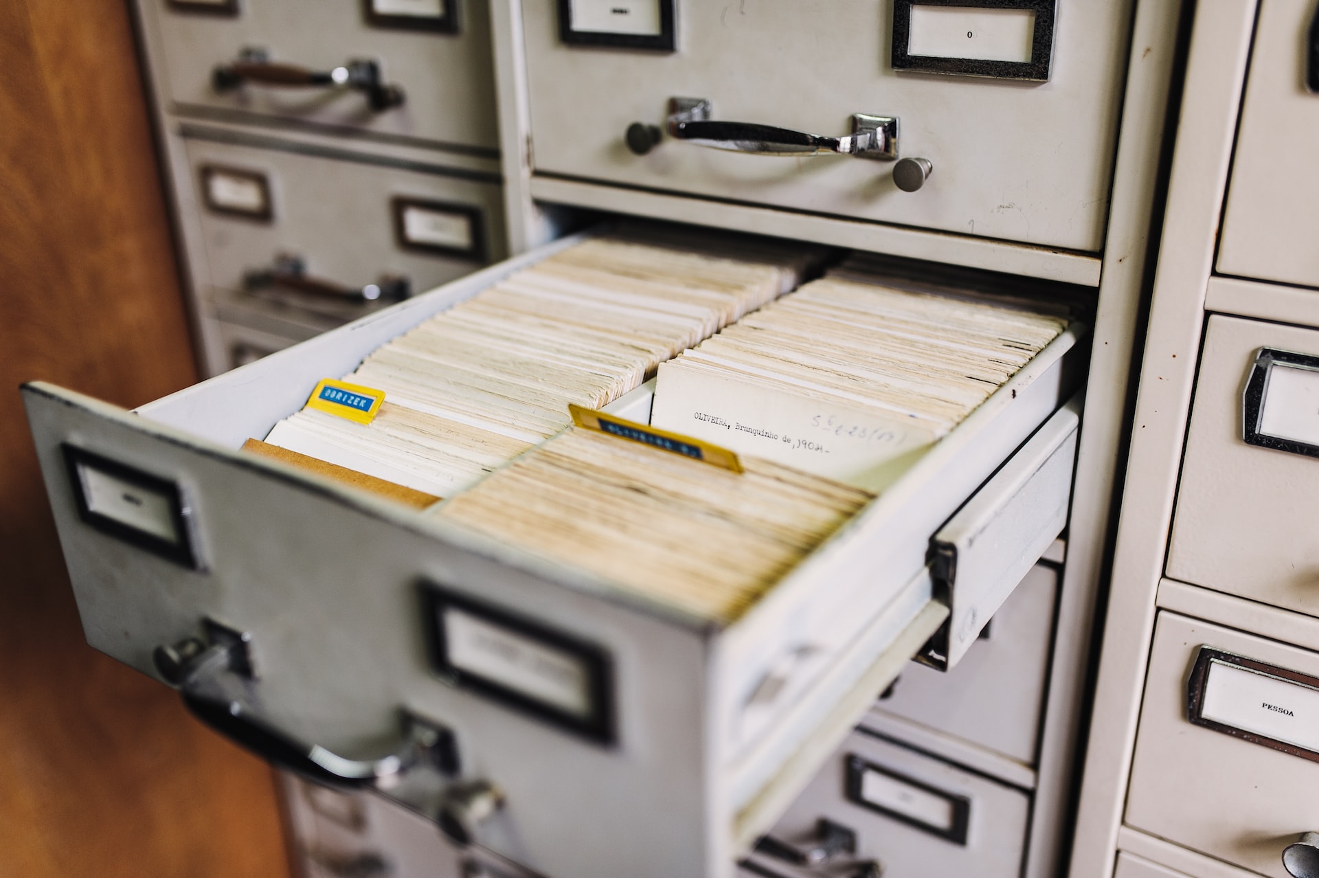Photograph of a filing cabinet filled with library index cards.